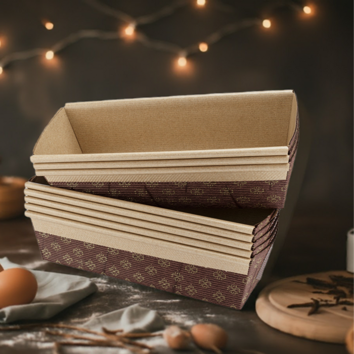 Kitchen Supply Stack of Elegant Paper Baking Loaf Pans for Baking Breads and Cakes on a counter with eggs and supplies